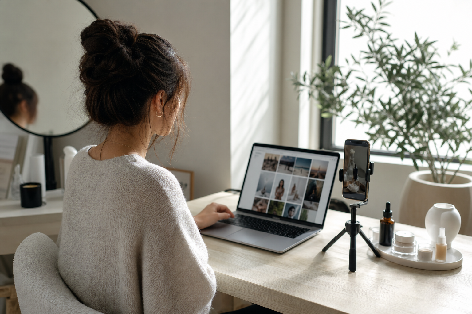 UGC creator browsing marketplace platforms on a laptop beside her filming setup