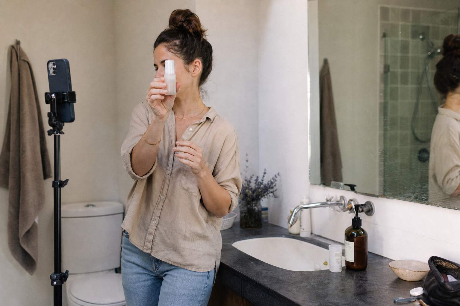 UGC creator filming a product video on a phone in a home setting