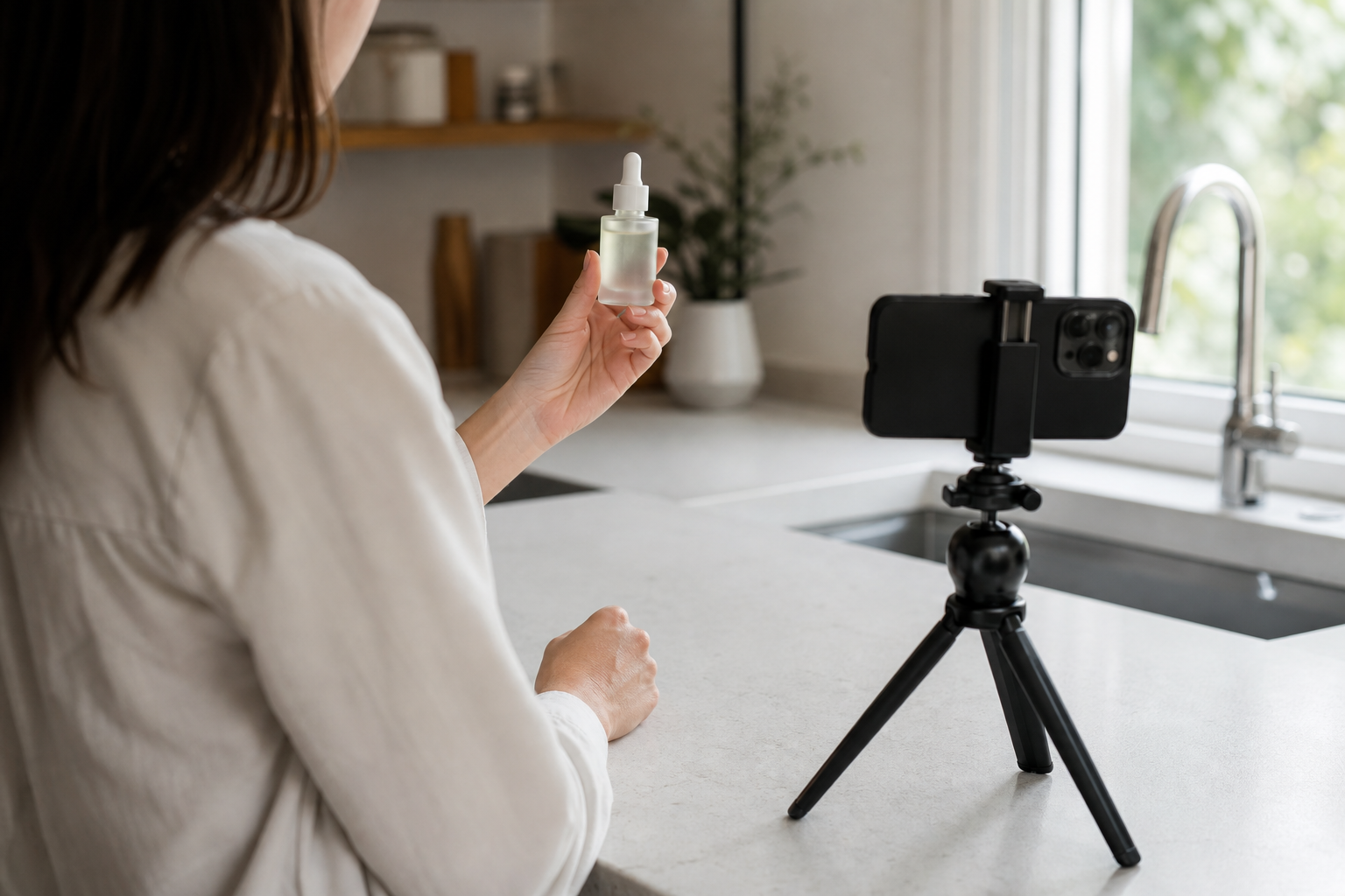 Beginner UGC creator filming a product sample video on a phone tripod